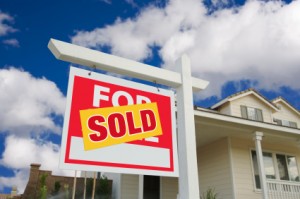 Sold Home For Sale Sign in Front of New House